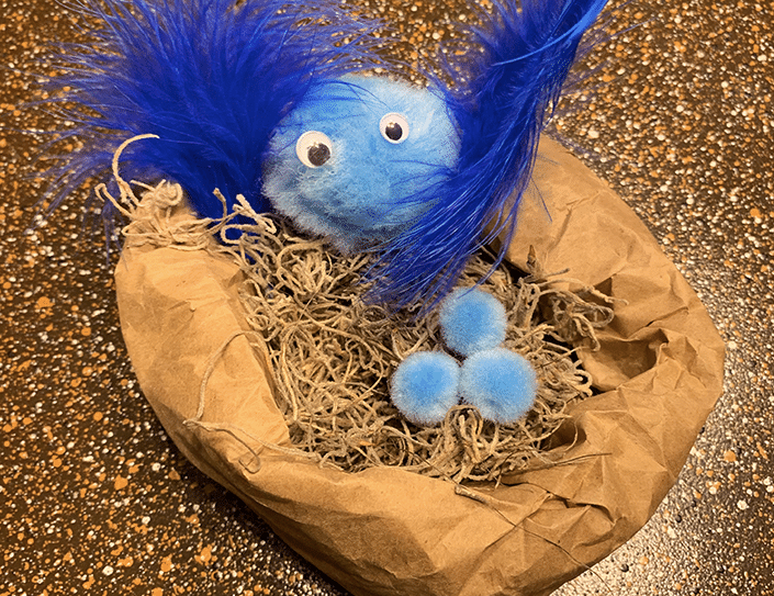 Blue bird in nest