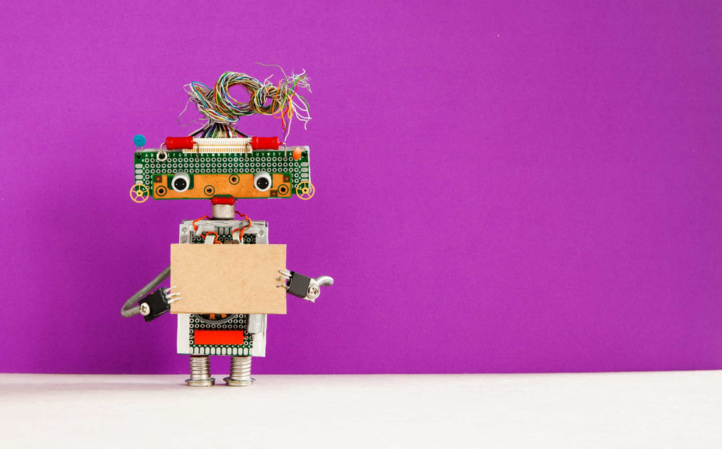 Robot with a cardboard card mockup. Creative design robotic toy holding a blank empty paper poster, purple wall background. copy space for text and design elements