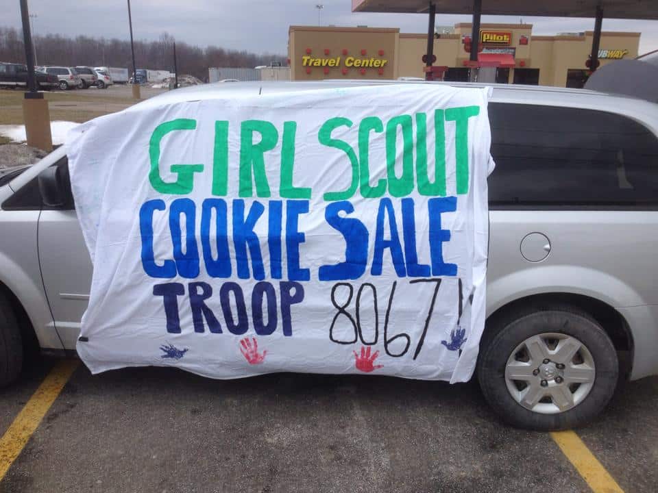 Cookie sale sign on mini van